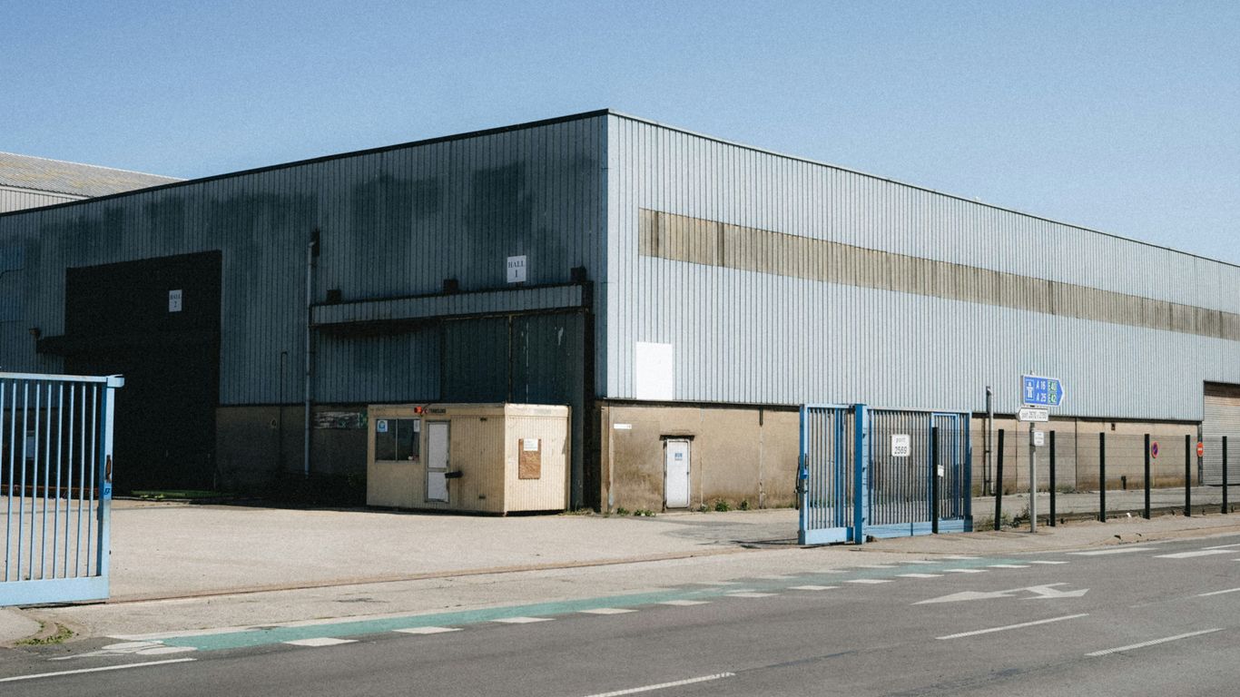 Wire mesh rolls in industrial warehouse